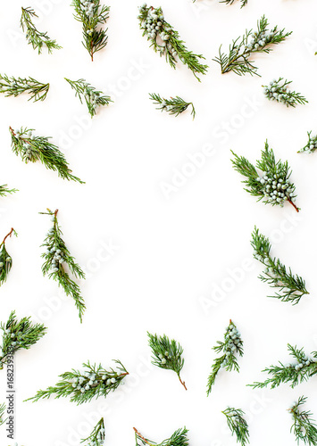 Christmas or New Year`s concept. Frame made of fir branches isolated on white background. Flat lay, top view