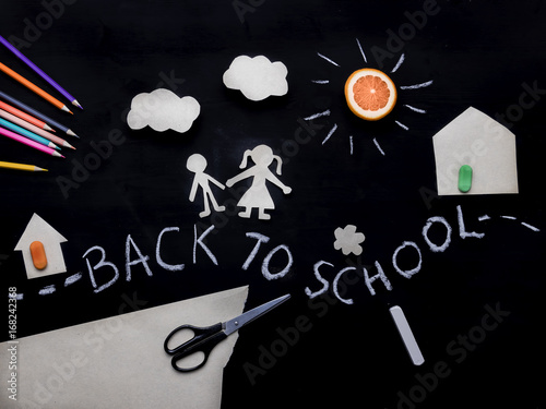 Back to school background with the child going to school. Children's creativity. Application on a blackboard. View from above photo