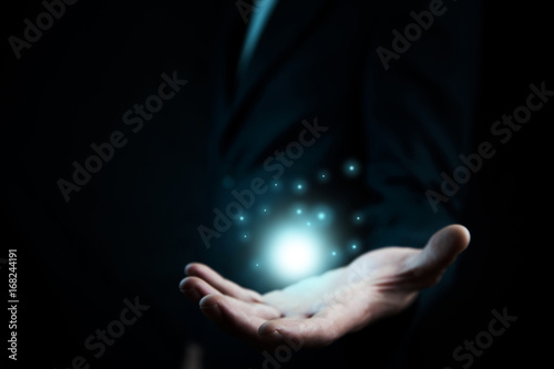 man hand showing color magic stars light