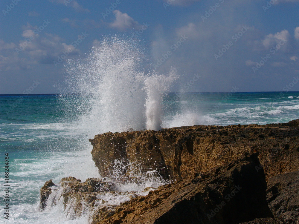 Water spout in rocks at Cozumel, Mexico