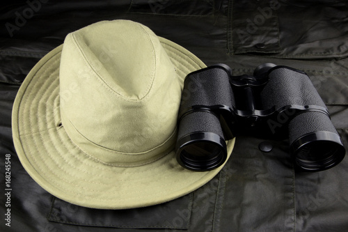 Binoculars and Hat on an Outdoor Coat