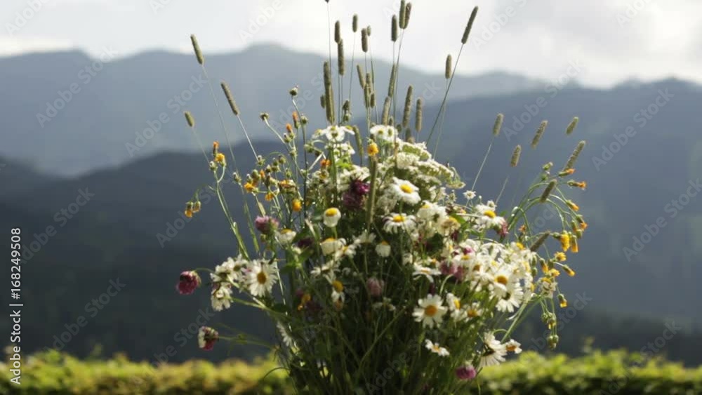 Bouquet of flowers near mountains