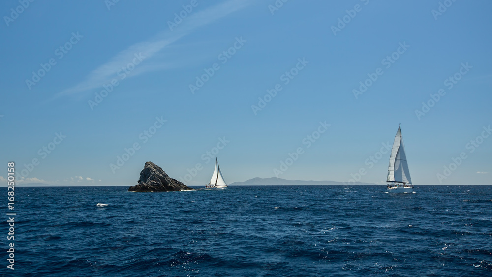 Obraz premium Sailing ship luxury yacht with white sails in the Sea.