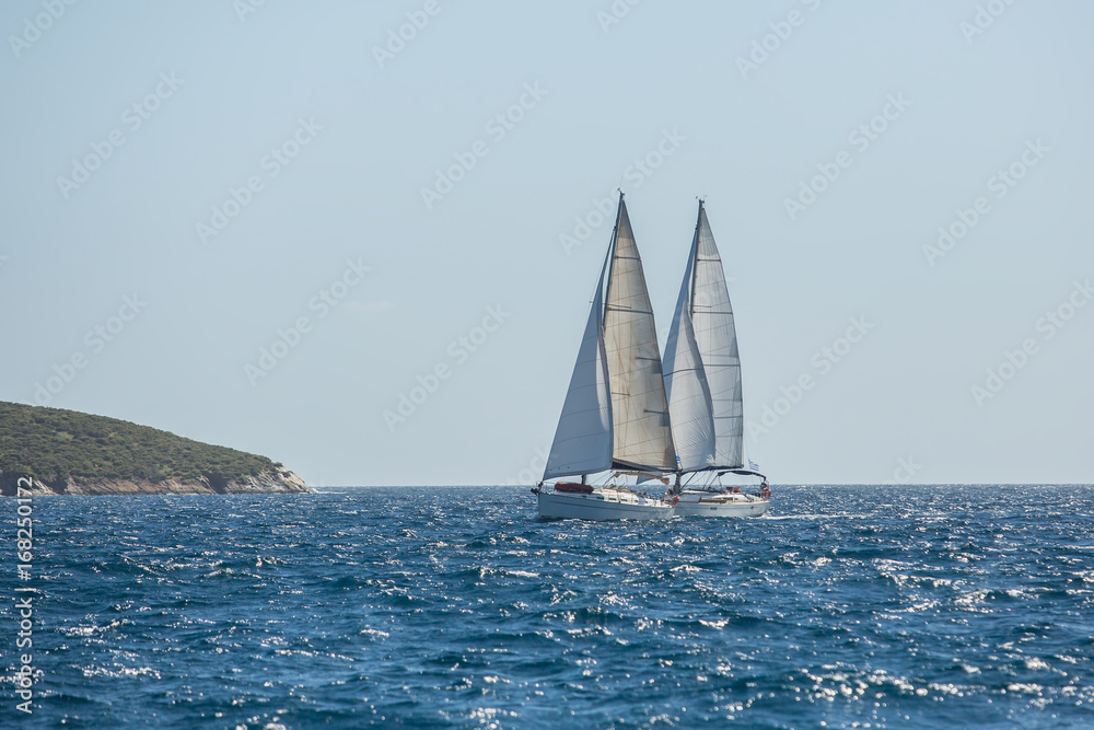 Boats in sailing regatta on the sea. Luxury yachts.