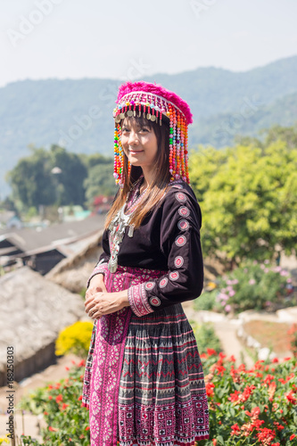 Beautiful asian girl wear traditional dress picking tea leaf in tea plantation at Doi Pui Chiangmai Province, Thailand