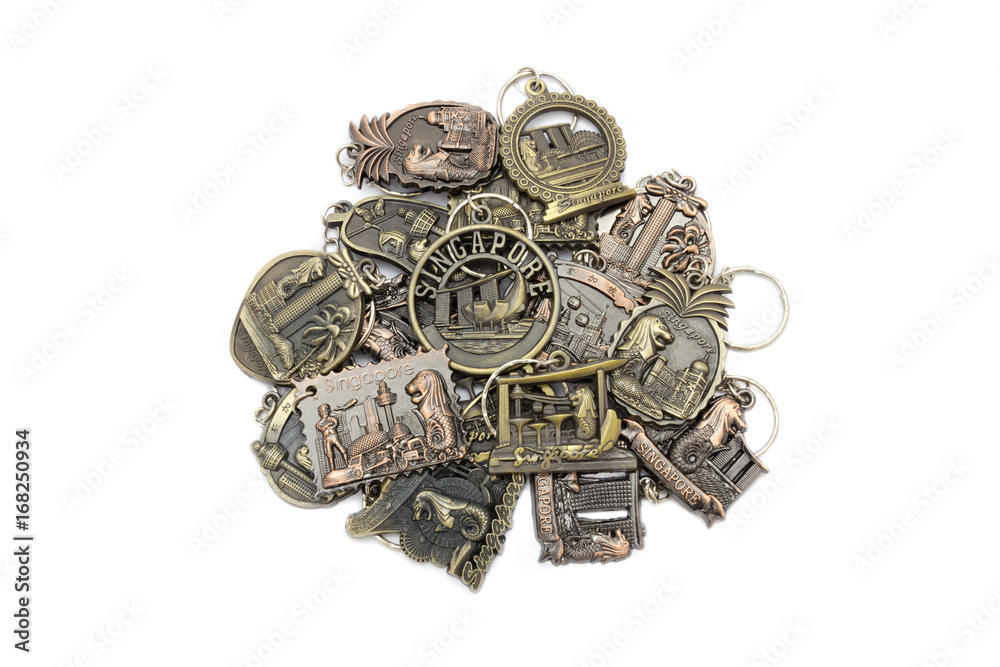 Metal key chain is souvenir from singapore sign isolated on white background. Metal key chain is souvenir from singapore sign isolated on white background.