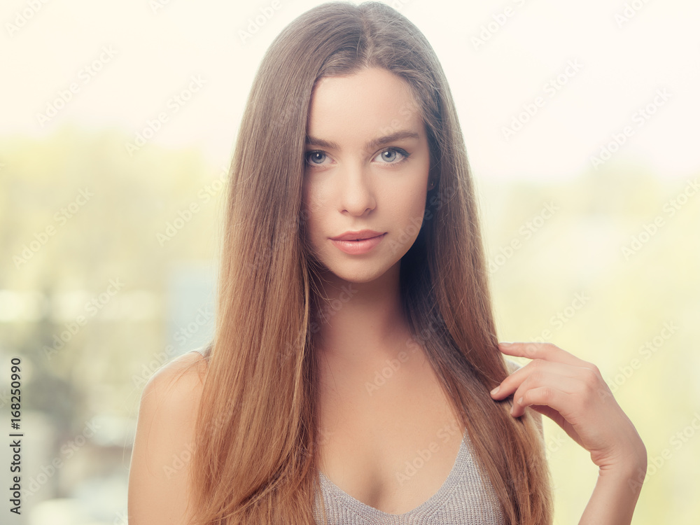 Beautiful young girl model in bright light with long hair Beautiful young girl model in bright light with long hair