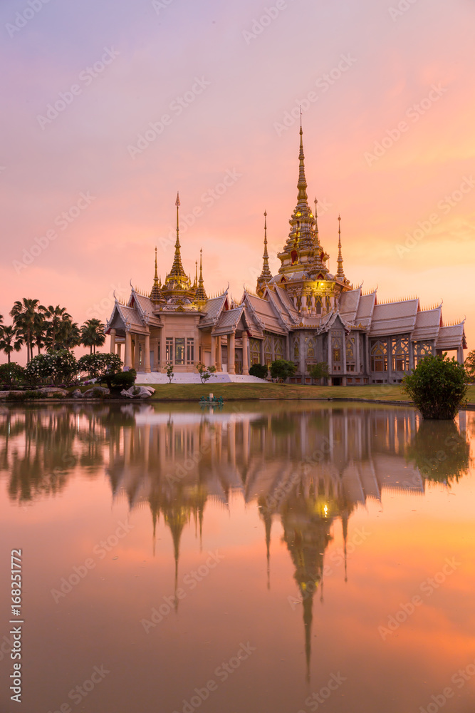 Landmark of wat thai with shadow reflection, sunset in temple at Wat None Kum in Nakhon Ratchasima province Thailand