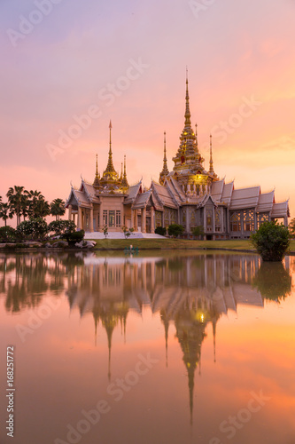 Landmark of wat thai with shadow reflection, sunset in temple at Wat None Kum in Nakhon Ratchasima province Thailand