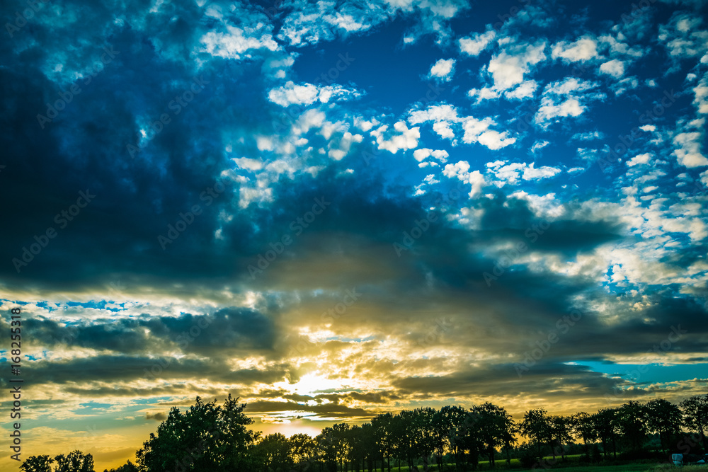 Obraz premium wonderful sunset with natural elements on the road in Europe