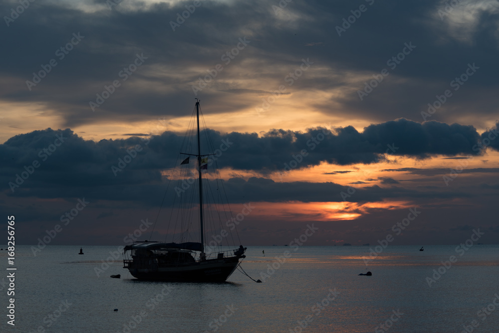 Twilight scene of boat with cloudy sky