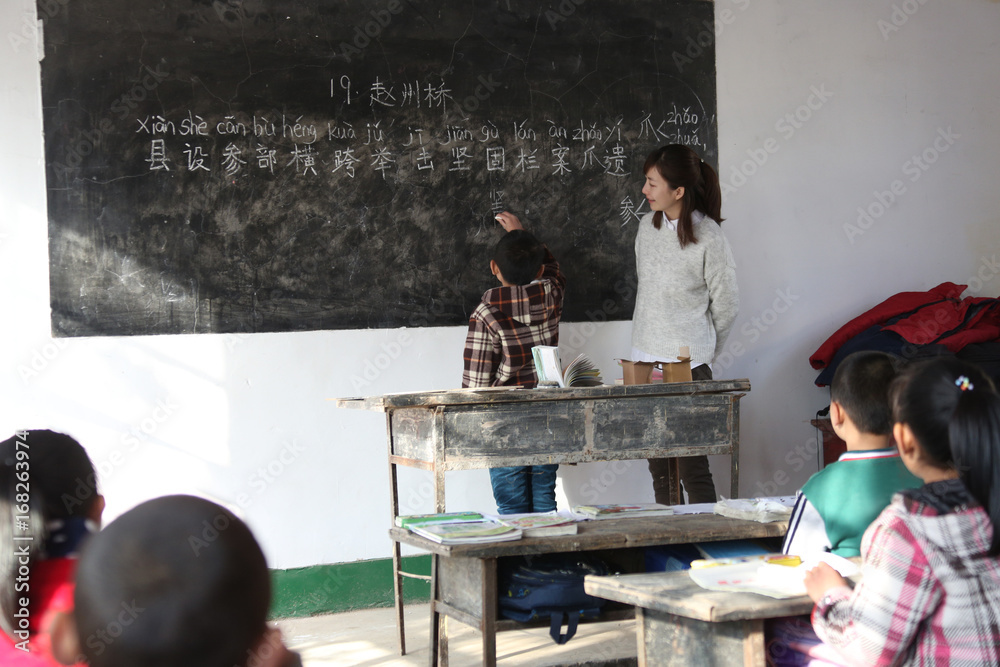 Rural female teachers and pupils in the classroom Rural female teachers and pupils in the classroom