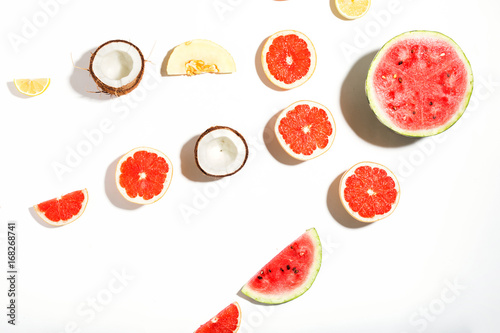 Fototapeta Naklejka Na Ścianę i Meble -  Creative layout made of watermelon, coconut, melon, grapefruit and lemon