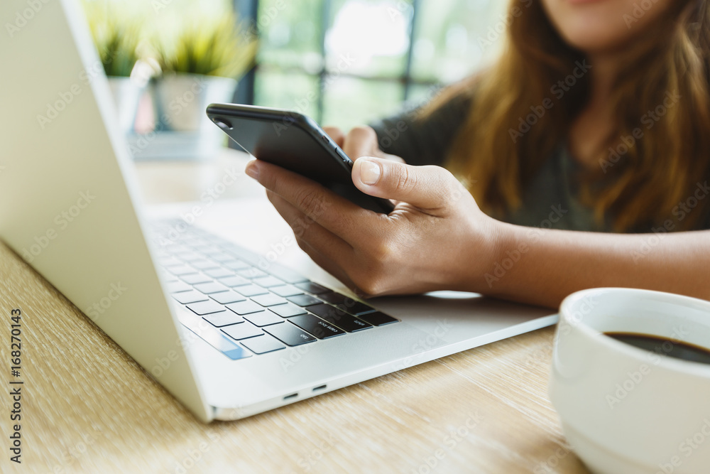 woman use smartphone on desk in office place woman use smartphone on desk in office place