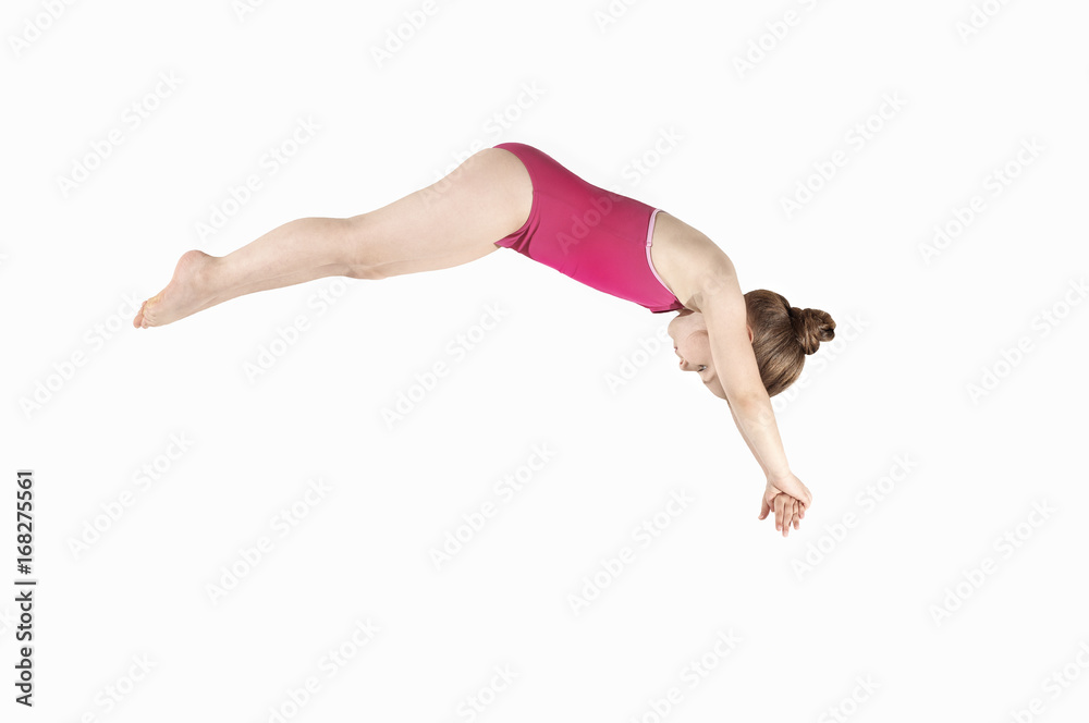 Little caucasian female 6 years old athlete in diver pose Little caucasian female 6 years old athlete in diver pose