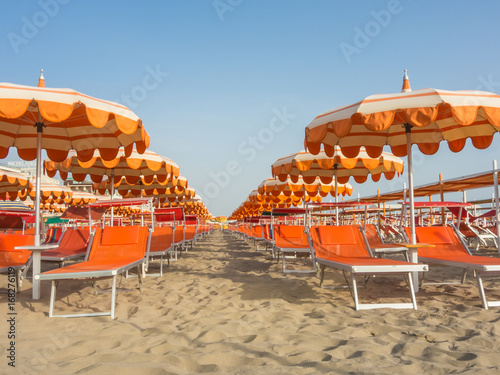 Umbrellas and gazebos on Italian sandy beaches. Adriatic coast. Emilia Romagna region.