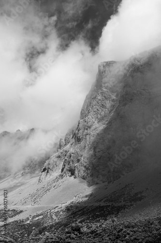 Black and white mountains with clouds. Atmospheric phenomena concept © Rafa