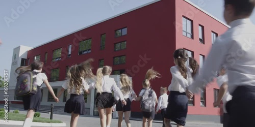 Happy Kids running to school. Back to school. Outdoors shooting 4k