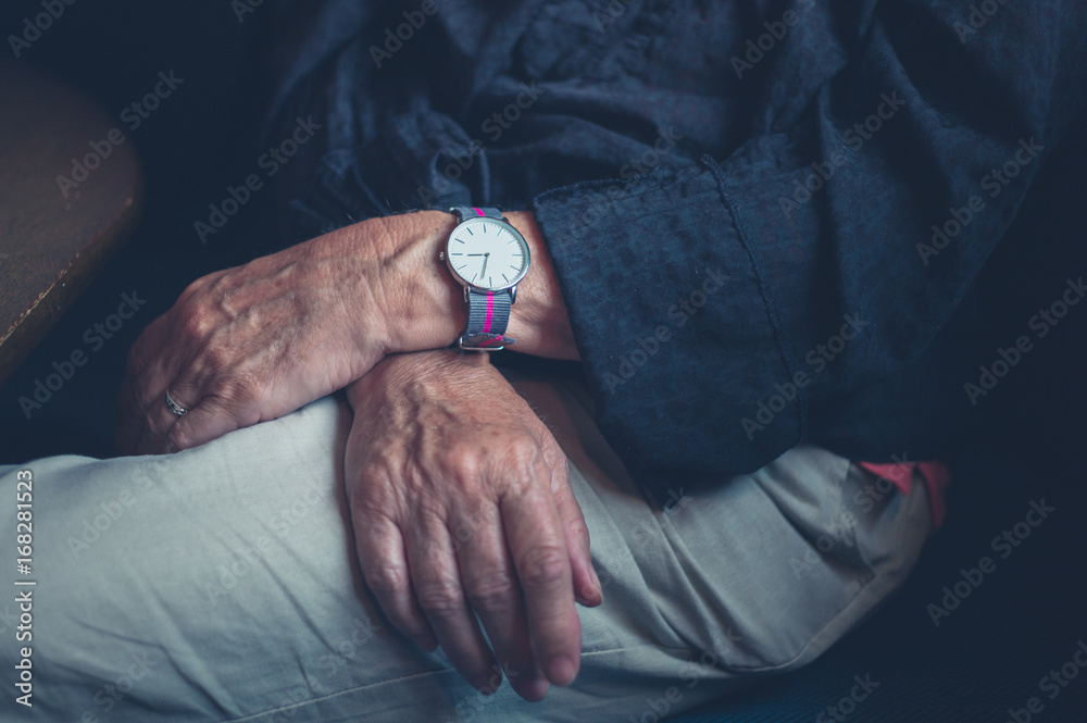 Senior woman's hands wearing watch