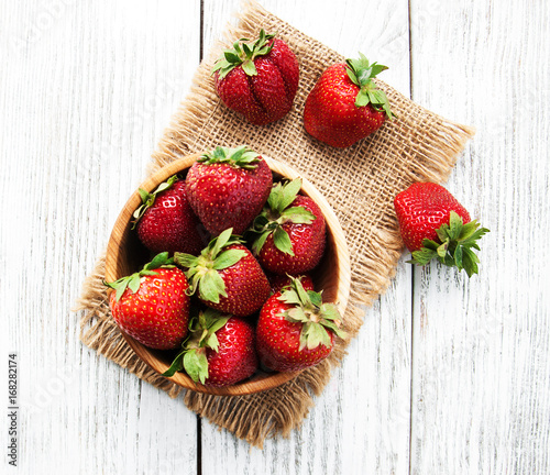 ripe strawberries on wooden table