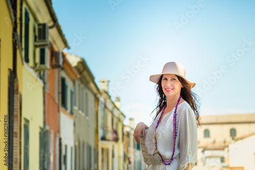 Beautiful mature tourist in  European village
