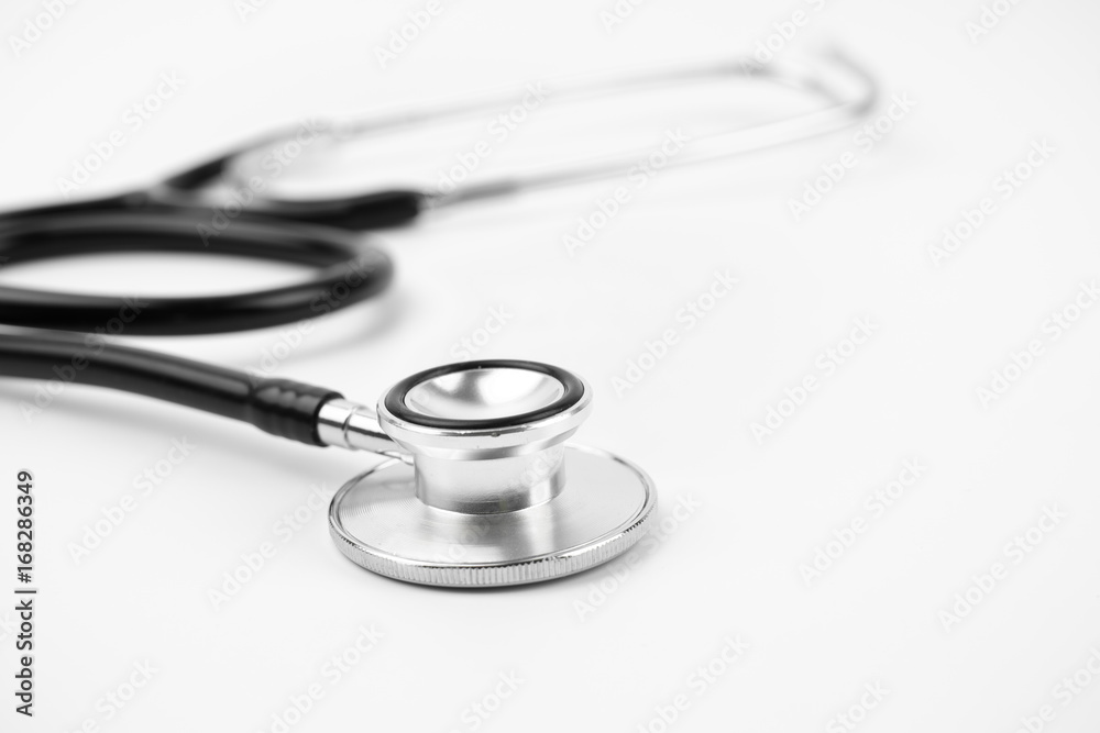 Close up view of black stethoscope on white isolate background Close up view of black stethoscope on white isolate background