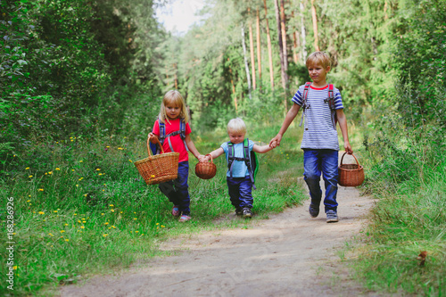 little boy with two girls going to forest