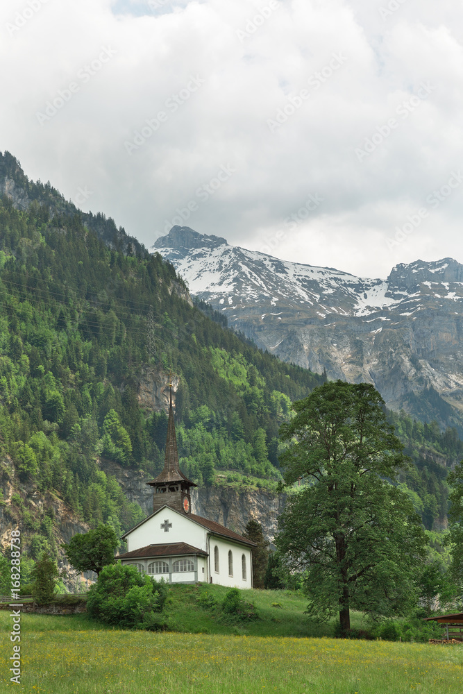Church in the background of mountains