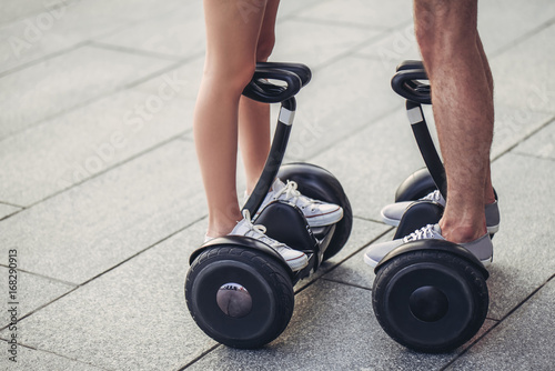 Young couple on gyro scooters