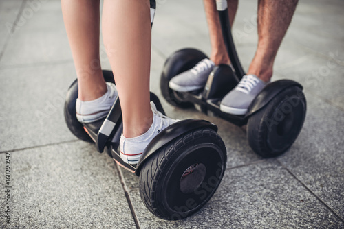 Young couple on gyro scooters