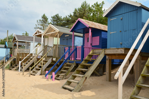 Brightly painted wooden beach huts at Wells-next-the-sea in Norfolk England © martincp