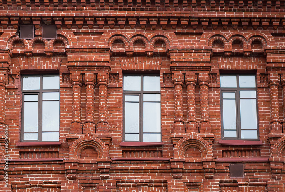 Three high windows in the red house Three high windows in the red house