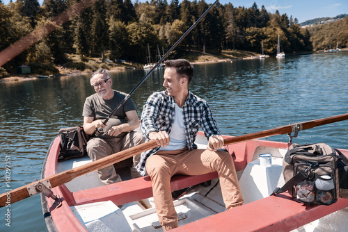 Two men spending time together on the lake.
