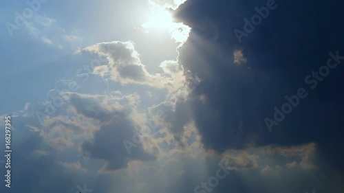 Beautiful timelapse with large clouds and sunshine breaking through cloud mass.