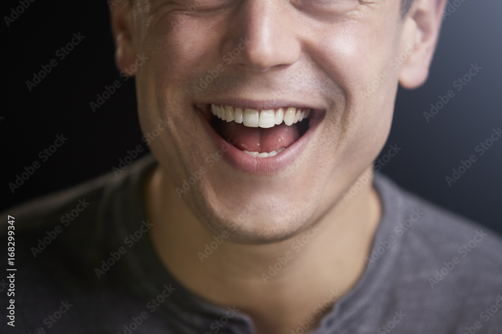 Cropped portrait of a laughing young white man Cropped portrait of a laughing young white man