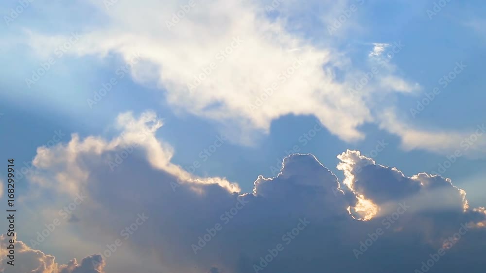 Beautiful timelapse with large clouds and sunshine breaking through cloud mass.