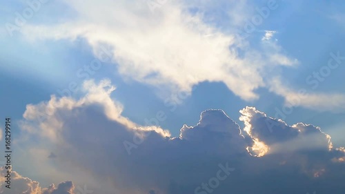Beautiful timelapse with large clouds and sunshine breaking through cloud mass.