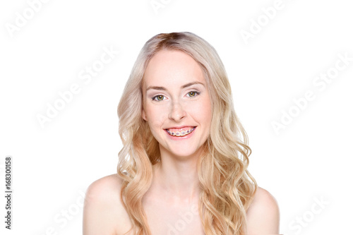 Woman with braces smiling cheerfully