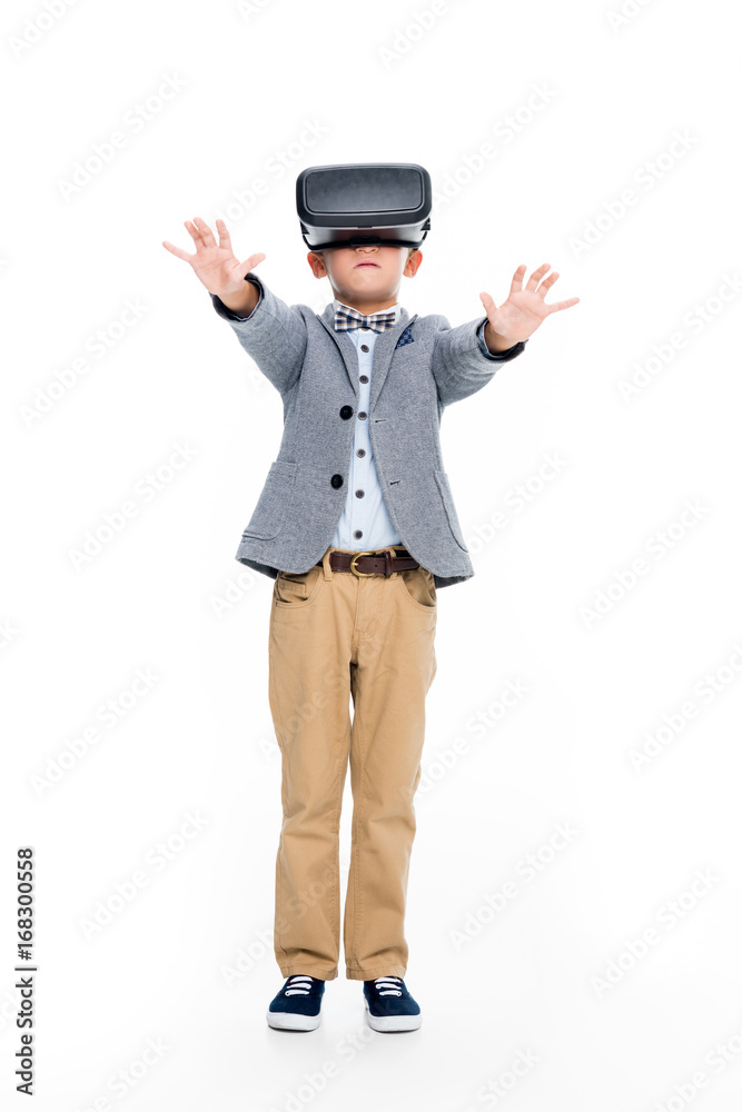 schoolboy in VR headset with outstretched hands schoolboy in VR headset with outstretched hands
