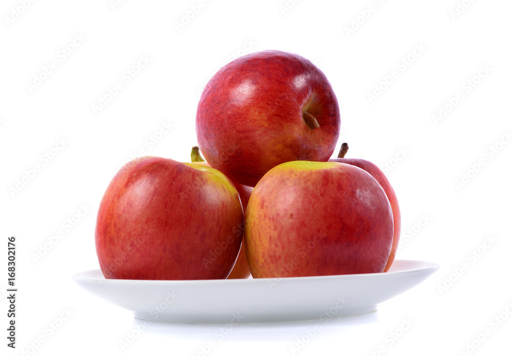 red apple in white plate isolated on white background red apple in white plate isolated on white background