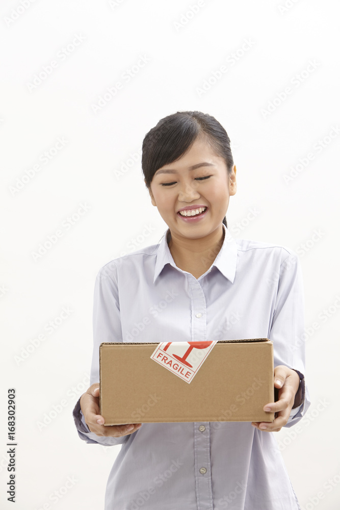 woman holding a box woman holding a box