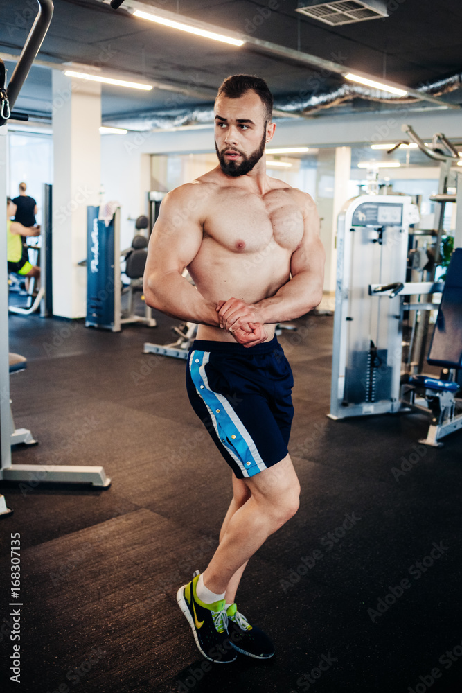Muscular guy in the gym Muscular guy in the gym