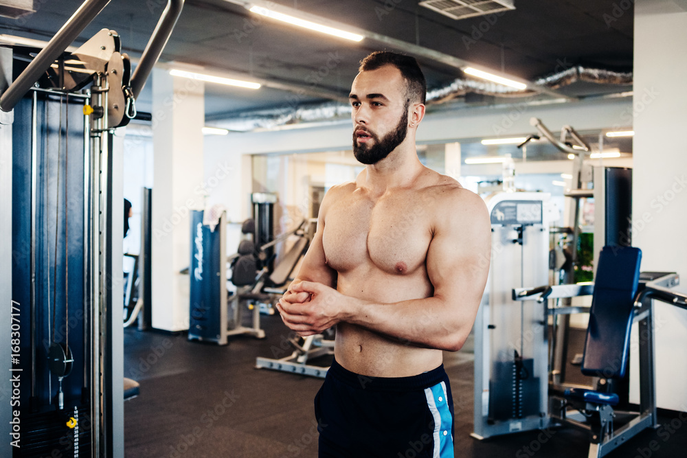Muscular guy in the gym Muscular guy in the gym