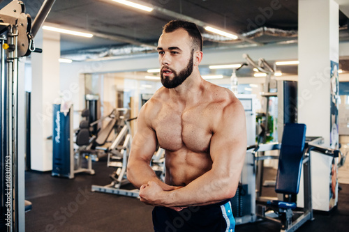 Muscular guy in the gym