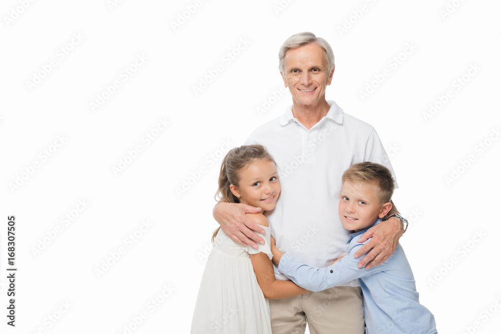 grandfather and grandchildren hugging together grandfather and grandchildren hugging together