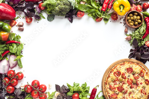 italian pizza and fresh vegetables © LIGHTFIELD STUDIOS