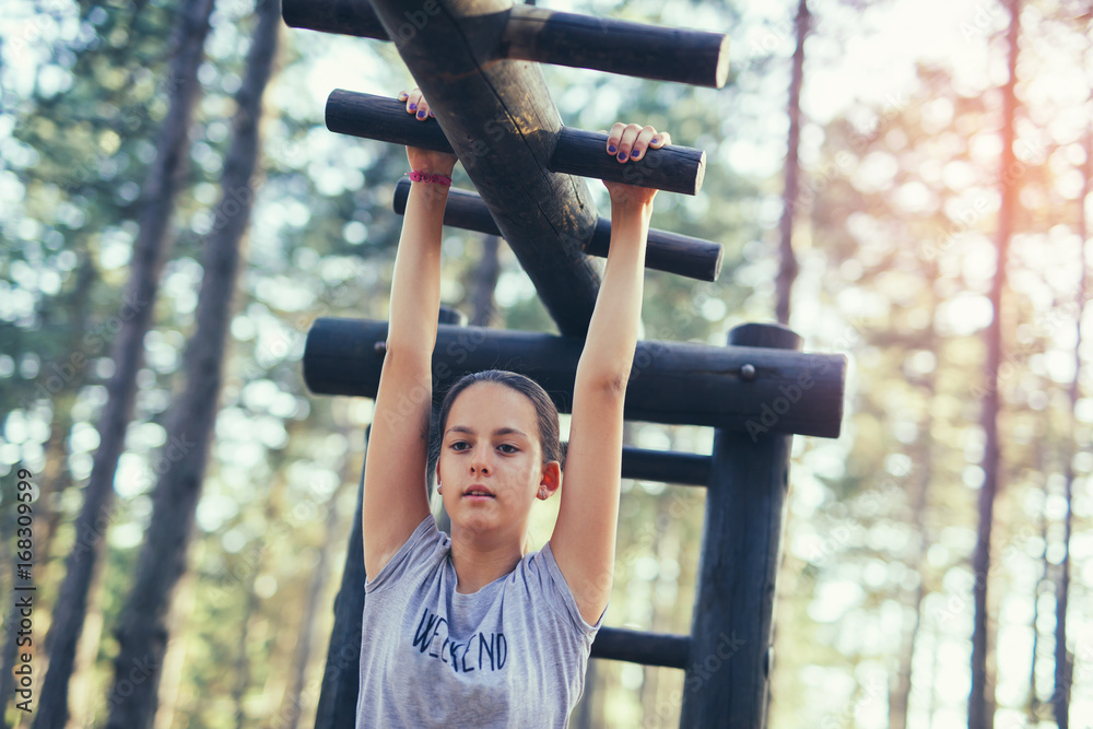 Obraz premium Beautiful smiling girl having sport activities outdoors