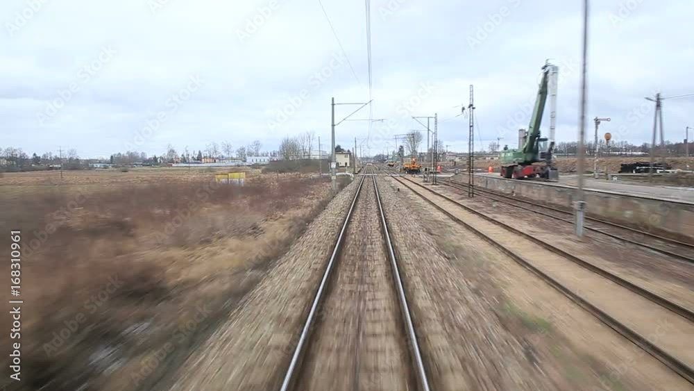 Railroad track running through coutry landscapes