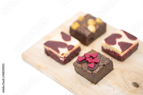 mini brownie on wooden board isolated on white background