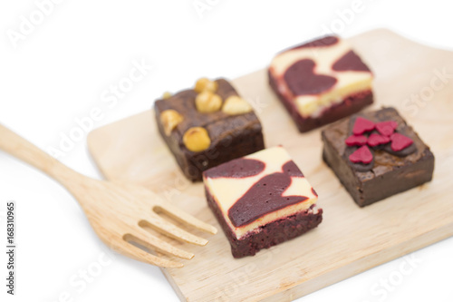 mini brownie on wooden board isolated on white background